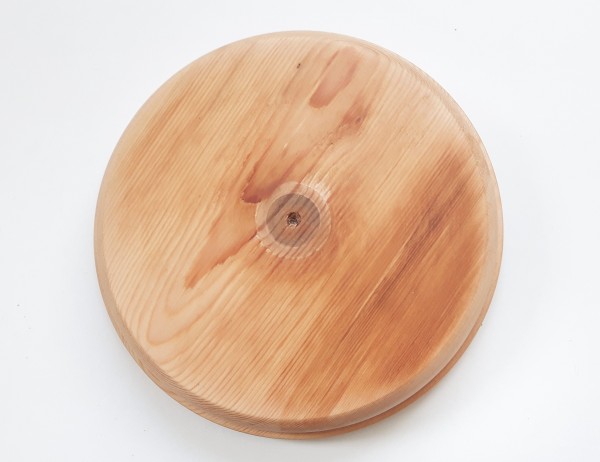 Large round softwood pattress , manufactured from pine